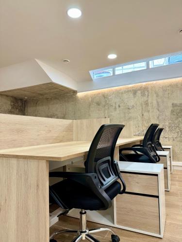 an office with two desks and two chairs at Residencia Mediterraneo in San Vicente del Raspeig