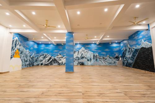 a room with mountains painted on the walls at Purna in Pokhara