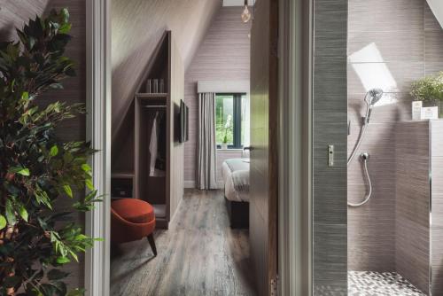 a hallway of a house with a bedroom at Ardlui Retreat Lodge 2 in Arrochar