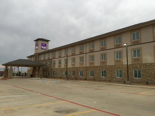 a large building with a clock tower on top of it at Sleep Inn & Suites Odessa near University in Odessa
