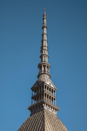 a view of the eiffel tower against a blue sky at Hostdomus - Bi Level Apartment in Pragelato