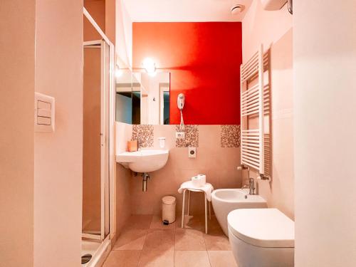 a bathroom with a white toilet and a sink at Ostello Bello Firenze in Florence