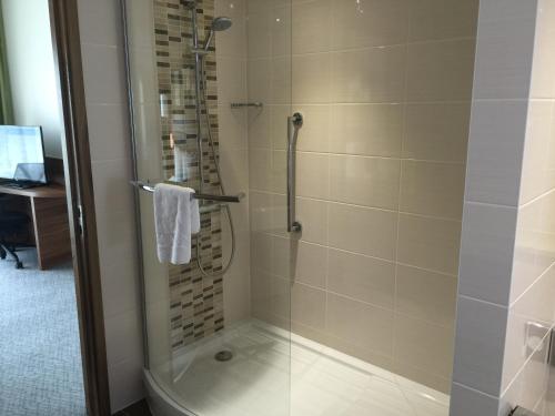 a bathroom with a shower with a glass door at Hilton Garden Inn Sunderland in Sunderland