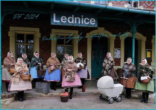 a group of women standing in front of a building at Ubytování nad sklípkem in Valtice