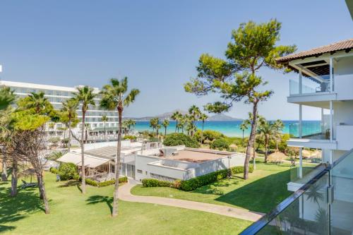 an aerial view of the house with the ocean in the background at Playa Esperanza Resort Affiliated by Meliá in Playa de Muro