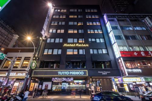 a building on a city street at night at Hotel Relax II in Taipei