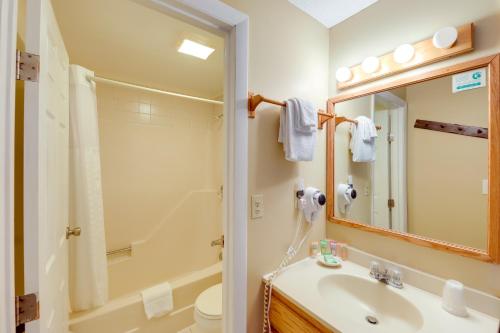 a bathroom with a sink and a shower and a toilet at North Conway Condo with Pool Access 2 Mi to Skiing in North Conway