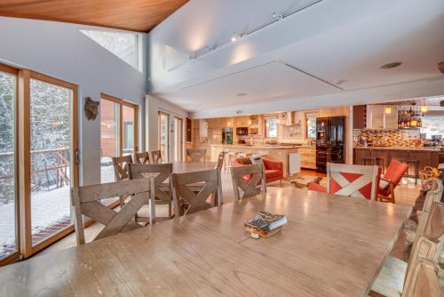 a kitchen and dining room with a table and chairs at White Mountain Escape with Separate In-Law Suite! in Thornton