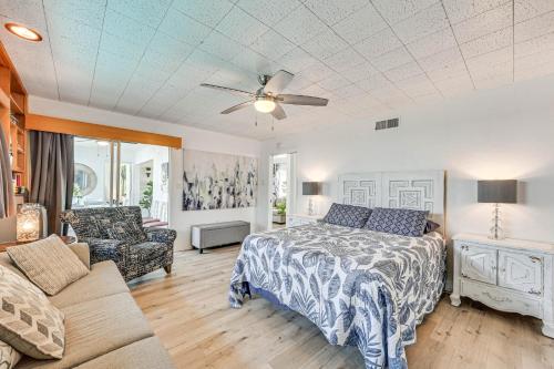 a bedroom with a bed and a couch at Spacious Chula Vista Home with Heated Pool and Hot Tub in Chula Vista