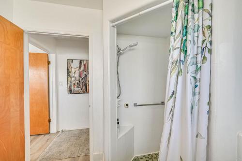 a bathroom with a shower and a shower curtain at Spacious Chula Vista Home with Heated Pool and Hot Tub in Chula Vista