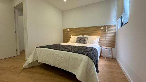 a bedroom with a large bed in a room at Living PDL 1 in Ponta Delgada