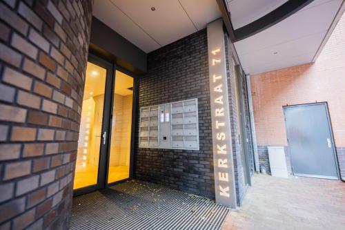 a brick building with a sign on the side of it at Studio serviced apartments with City view (KS71-R) in Hilversum
