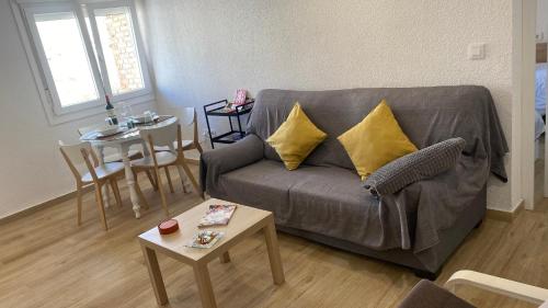 a living room with a couch and a table at PLAZA ANDALUCIA APARTMENT - Con Encanto in Córdoba