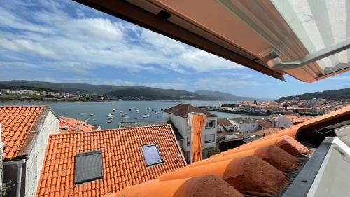 a view of the water from the roof of a building at Casa Pieiteiro in Corcubión