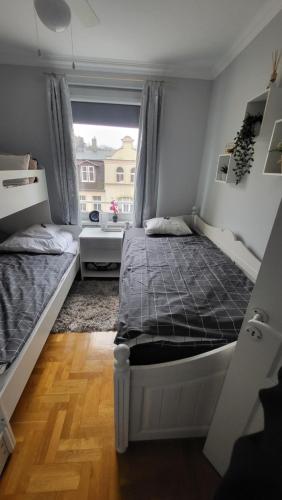 Gulta vai gultas numurā naktsmītnē Apartament Julietta