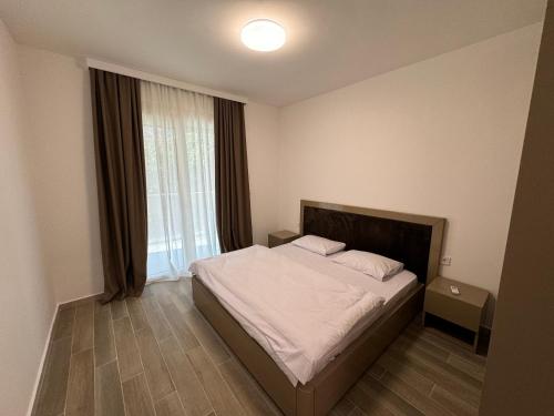 Postel nebo postele na pokoji v ubytování K apartments