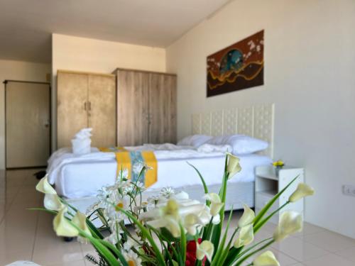Ένα ή περισσότερα κρεβάτια σε δωμάτιο στο Mina View Condo 2