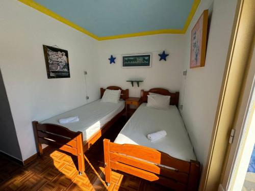 two beds in a room with stars on the wall at Lagos Central Hostel in Lagos