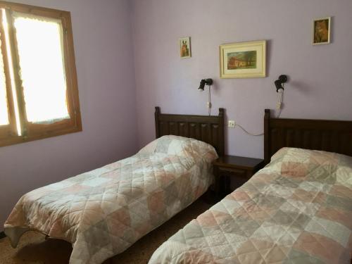 Ένα ή περισσότερα κρεβάτια σε δωμάτιο στο Andora Casa