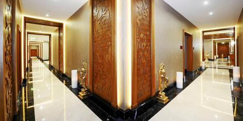 a hallway of a hotel room with a elevator at Crowne Plaza Bursa Convention Center & Thermal Spa by IHG in Bursa