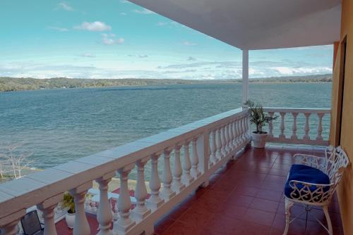 a balcony with a view of the water at Hotel Villa del Lago in Flores