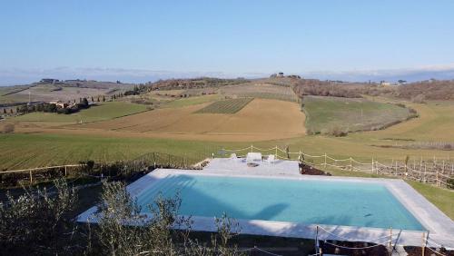 an overhead view of a swimming pool in a field at Agriturismo Antica Corte - Ortensie in Montepulciano