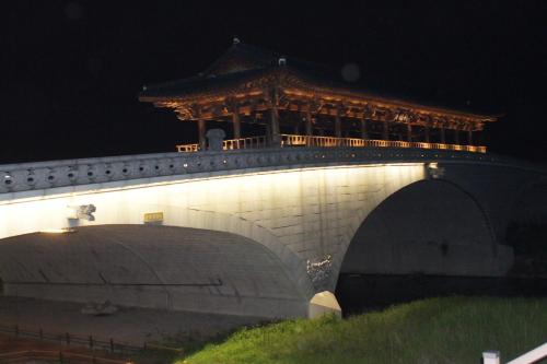 a bridge with a building on top of it at Greem Guesthouse in Jeonju