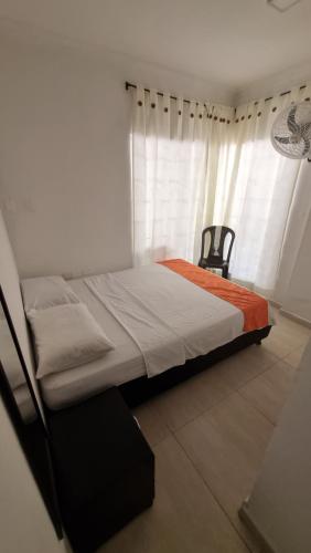 Postel nebo postele na pokoji v ubytování Cabaña Gaia Rodadero