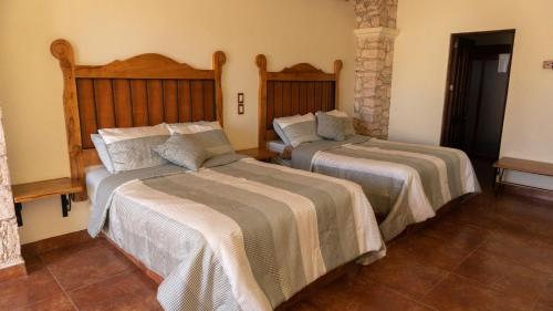 Postel nebo postele na pokoji v ubytování Hotel Mariazel