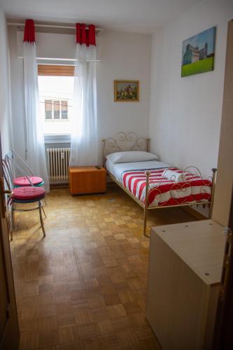 Ένα ή περισσότερα κρεβάτια σε δωμάτιο στο Venice Holiday
