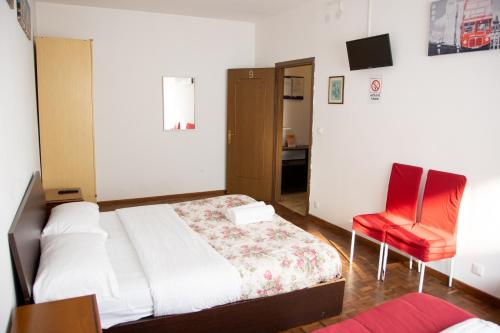 Ένα ή περισσότερα κρεβάτια σε δωμάτιο στο Venice Holiday