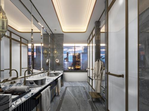 a bathroom with two sinks and a view of a city at InterContinental Tashkent, an IHG Hotel in Tashkent