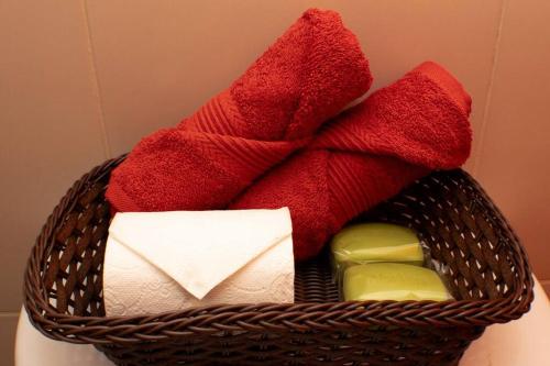 a basket filled with towels and toiletries at San Juan Loft in Santiago