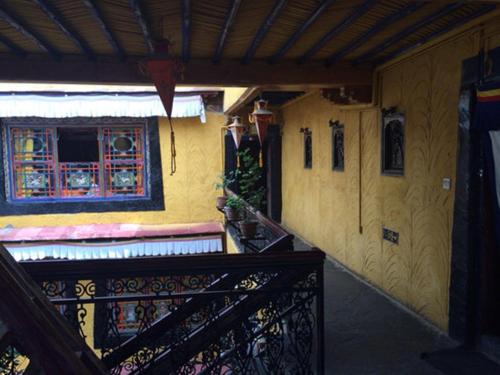 a stairway leading to a house with a window at House Of Shambhala in Lhasa