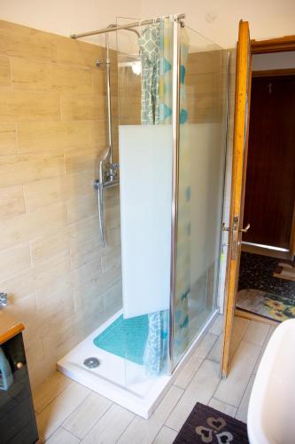 a shower with a glass door in a bathroom at Venice Best Vacation in Marghera