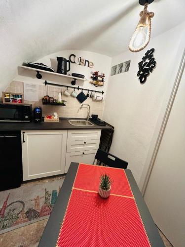 a kitchen with a table with a pineapple on top of it at Cantovì in Bari