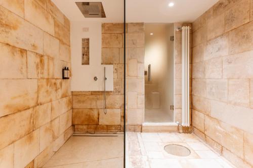 a bathroom with a shower and a walk in shower at Aeris Suite & Relax in Polignano a Mare