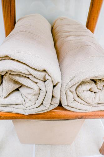 a pile of towels sitting on a wooden shelf at Kissamos Bay Hotel in Kissamos