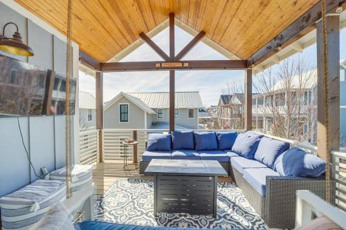 a patio with a blue couch and a table at Cozy Carlton Landing Home - Pools and Lake Access in Canadian
