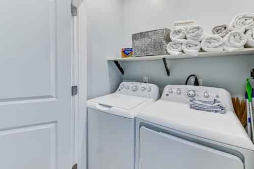 a white laundry room with two washing machines and towels at Pet-Friendly New Albany Home Less Than 7 Mi to Louisville! in New Albany
