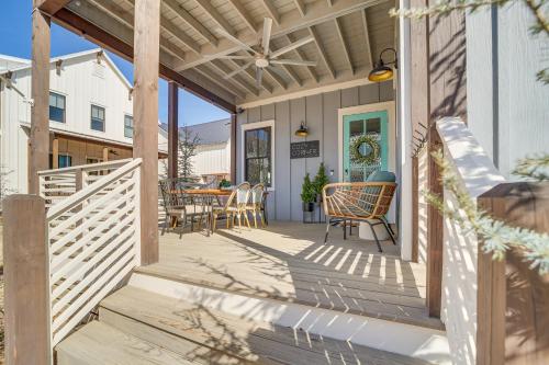 a wooden porch with chairs and a table at Cozy Carlton Landing Home - Pools and Lake Access in Canadian
