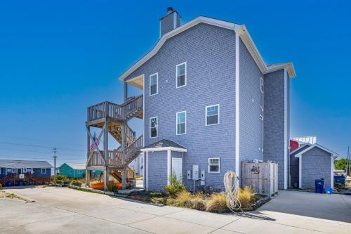 a large house with a spiral staircase on the side of it at Ocean-View Apt in Emerald Isle - Walk to Beaches! in Emerald Isle