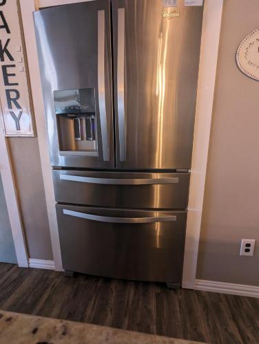 a large stainless steel refrigerator in a room at Robbins Nest in South Toledo Bend