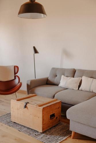 a living room with a couch and a coffee table at Staudingerhof in Staudach-Egerndach