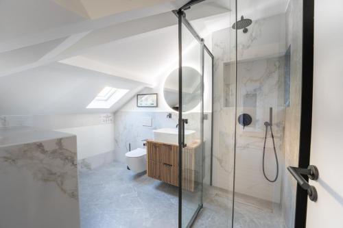 a bathroom with a shower with a toilet and a sink at Monte Carlo Monaco Border - luxury, modern, cozy with home feelings and See View in Beausoleil