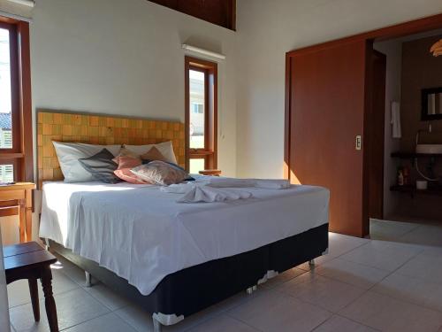Giường trong phòng chung tại Vila Figueiredo das Donas