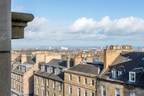 a view of a city from a building at RÌGH Residences - George Street in Edinburgh