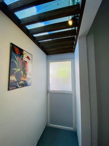 an empty room with a door and a window at OVIYA Guest & Rest in Weligama