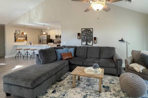 a living room with a couch and a table at New Beautiful 3 Bedroom Condo in Bettendorf in Bettendorf