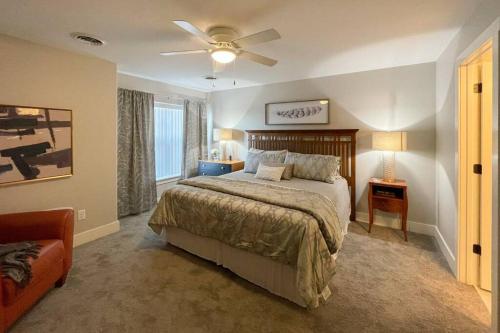 a bedroom with a bed and a ceiling fan at New Beautiful 3 Bedroom Condo in Bettendorf in Bettendorf